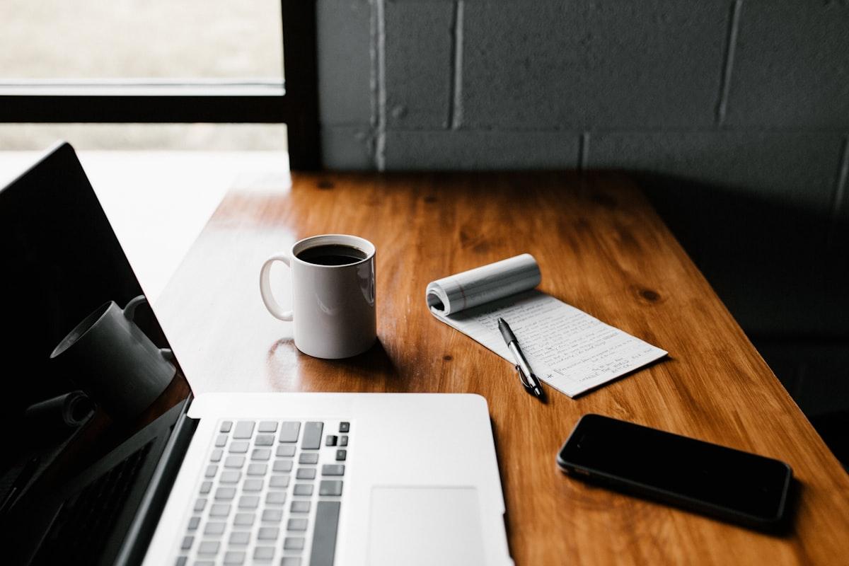 Minimalist productivity desk setup with a tablet and stylus, showcasing the tools needed for effective active recall and spaced repetition.