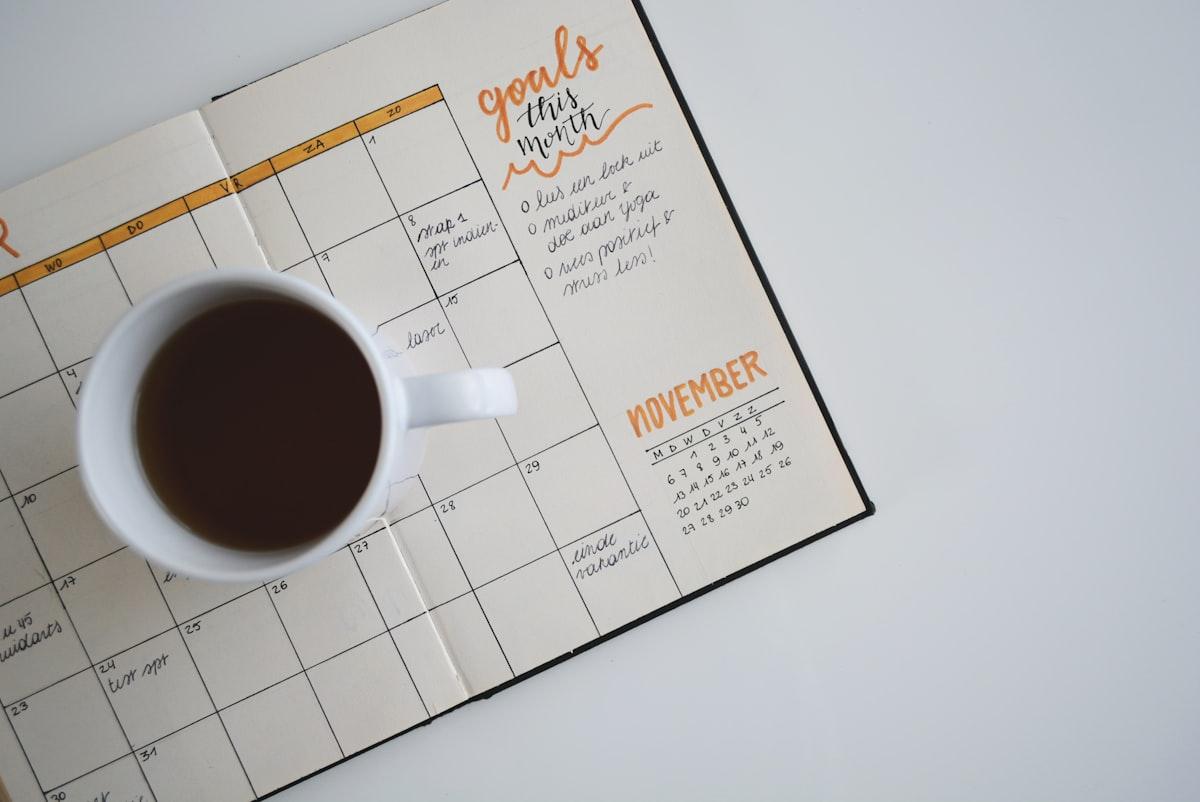 A close-up of a modern desk planner and calendar, representing structured planning, time blocking, and task prioritization for exams.